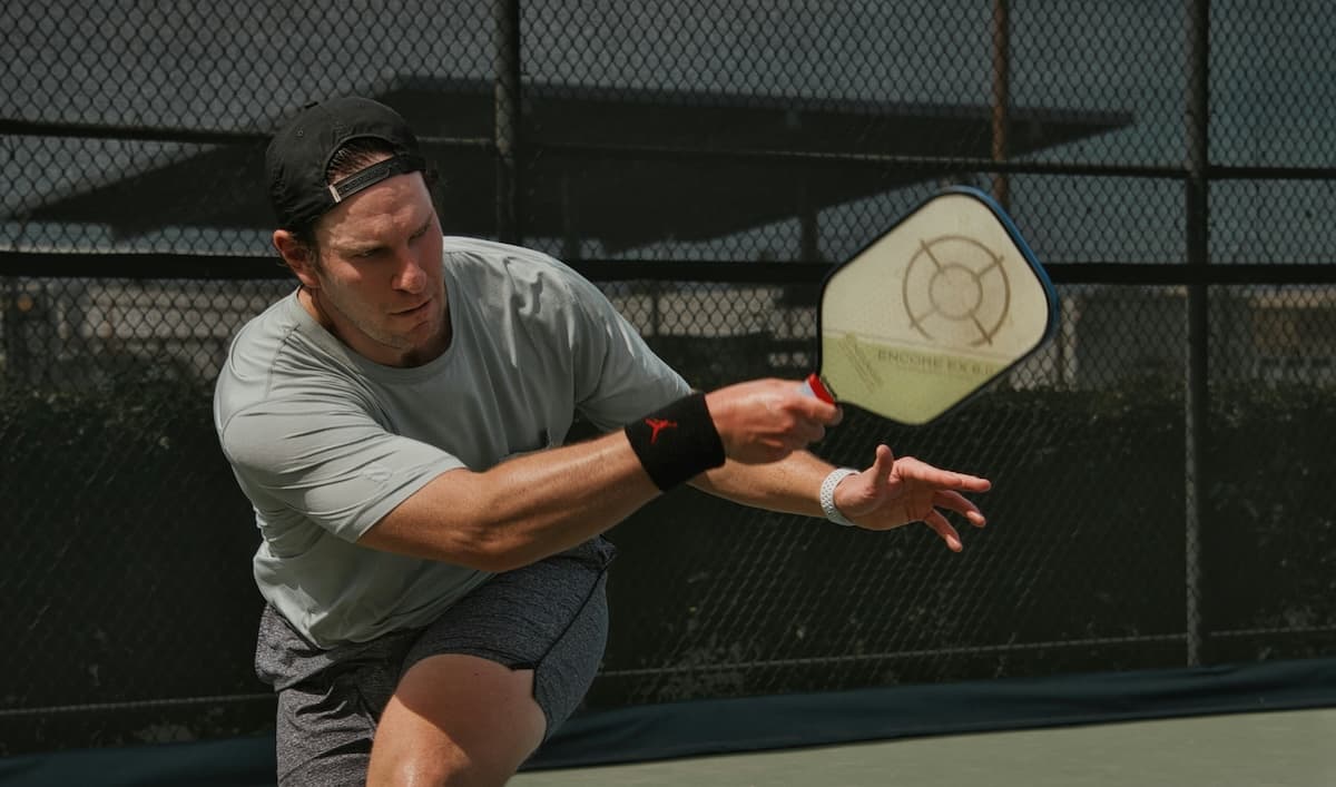 Pickleball players on an indoor court